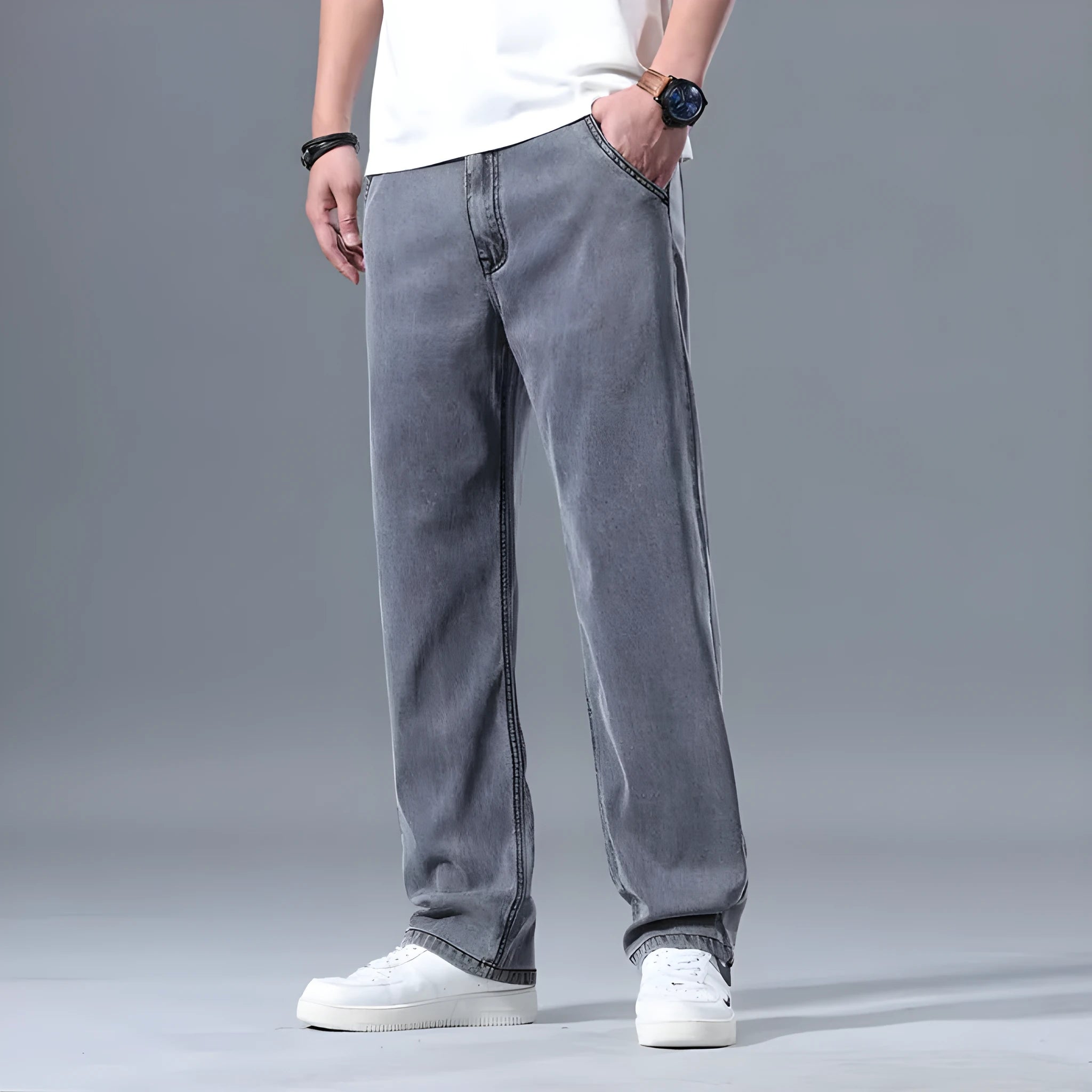 Man wearing light blue loose straight-leg lyocell blend casual jeans.