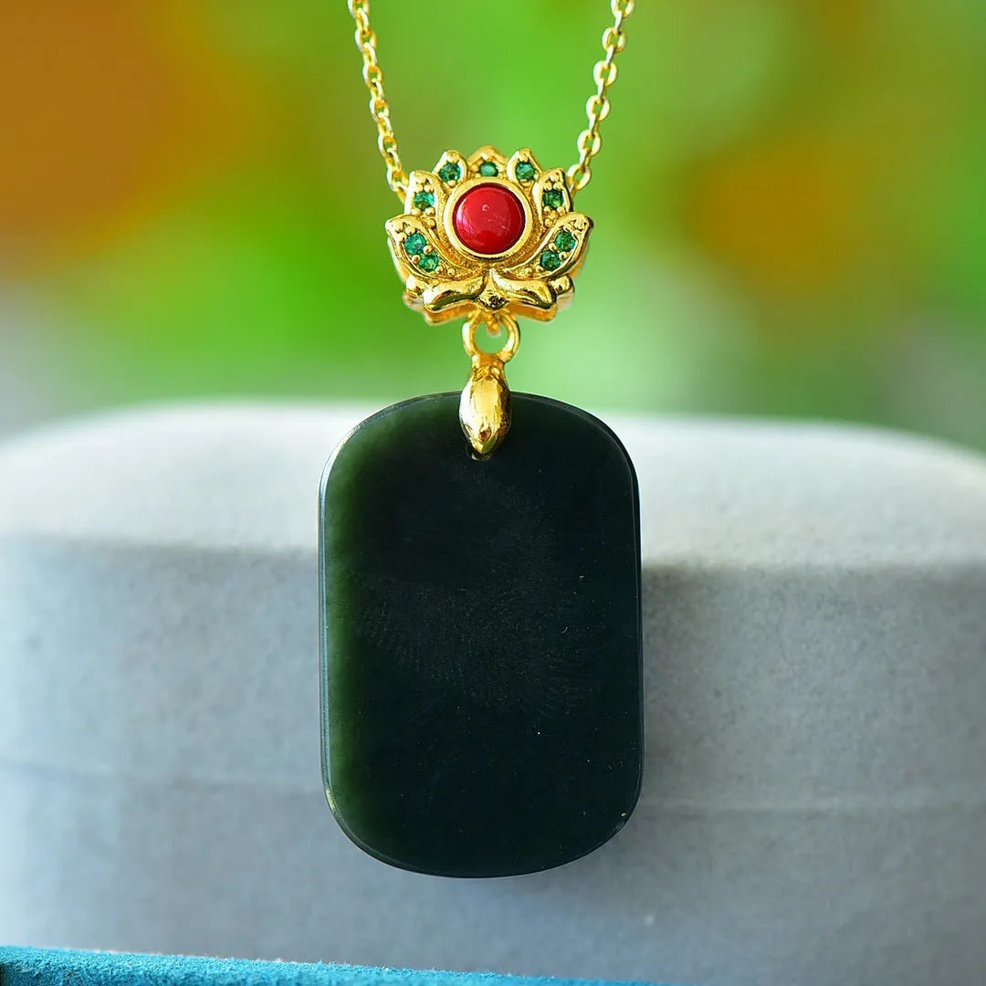 Flat geometric Hetian jade pendant with copper inlay on a necklace chain.