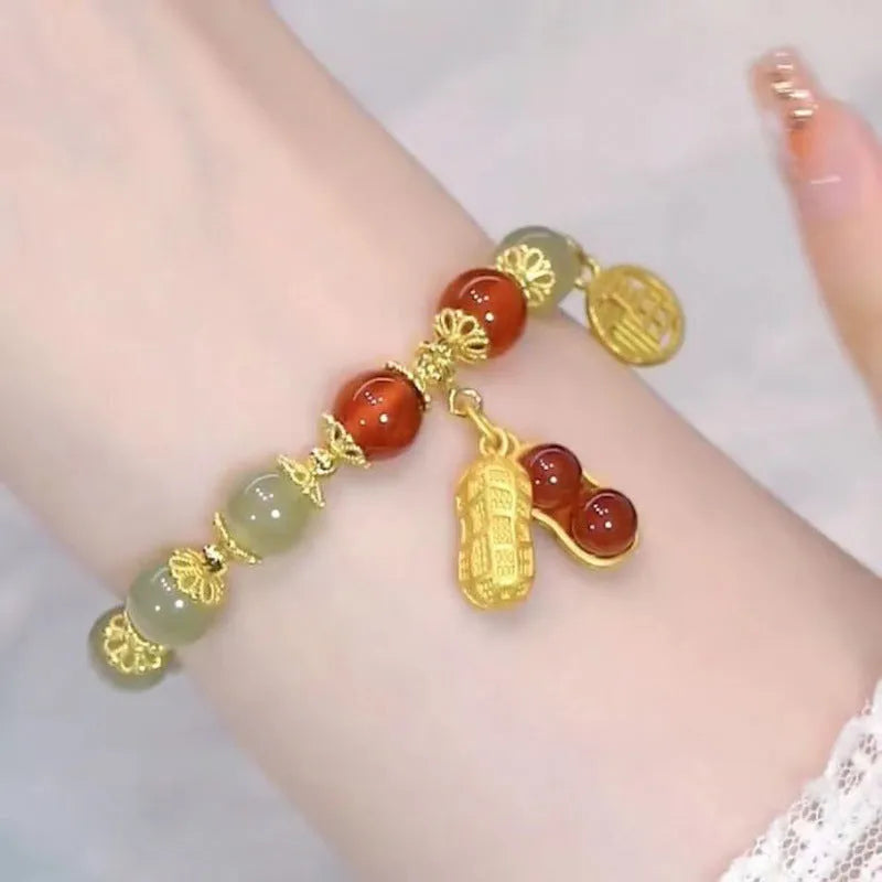 Handmade Chinese style glass bracelet with bamboo joint beads in a red Lvzhu Duobao design.