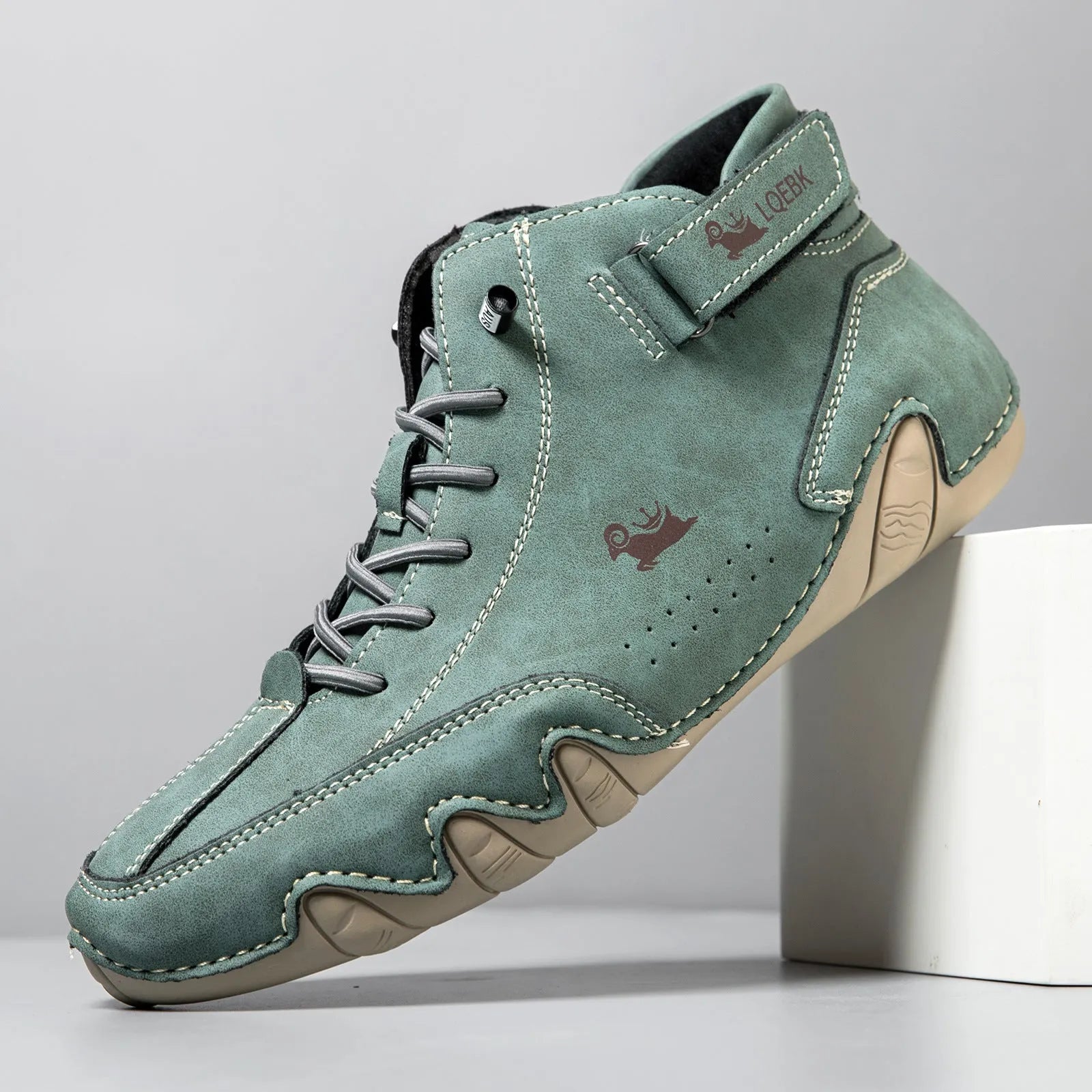 Men's brown high-top octopus Martin boots with a round toe and visible stitching on a flat rubber sole.