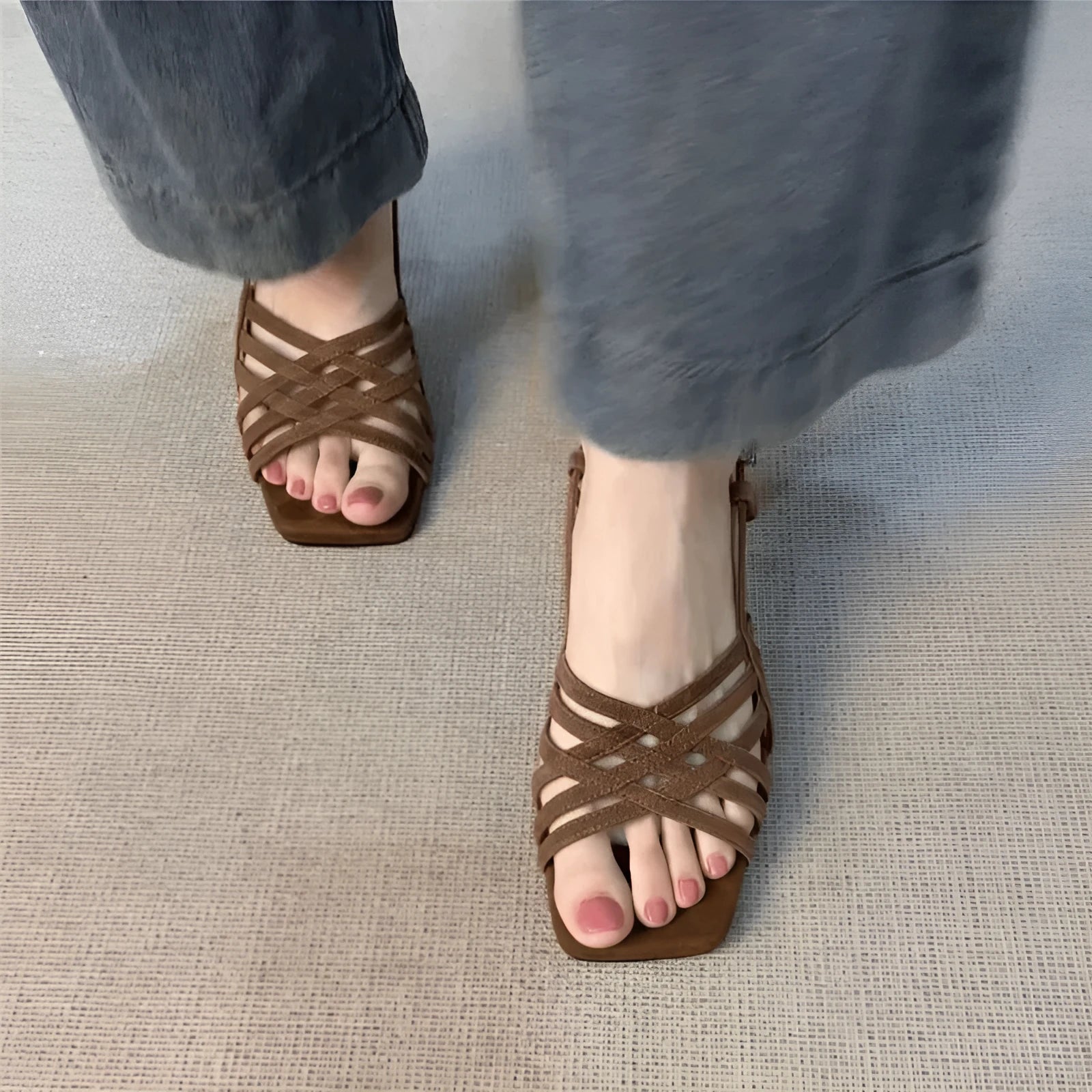 Light brown women's retro sandals with thin cross straps, ankle buckle, and a square toe on a mid heel.