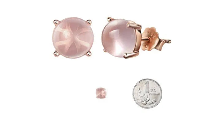 Rose gold drop shape stud earrings with synthetic ross quartz crystal inlay.