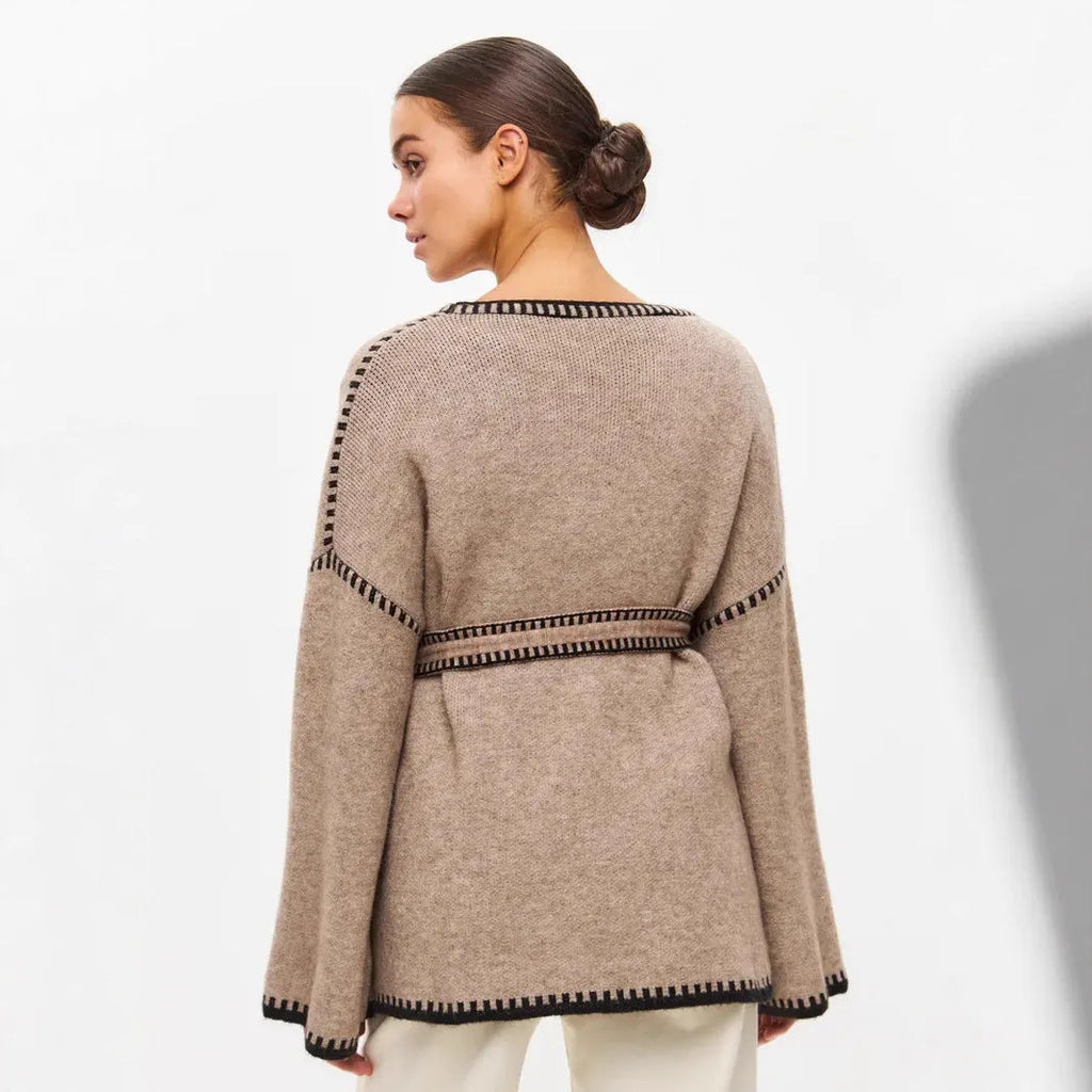 Lace-up front knitted cardigan in imitation cashmere fabric showing loose fitting design and long sleeves