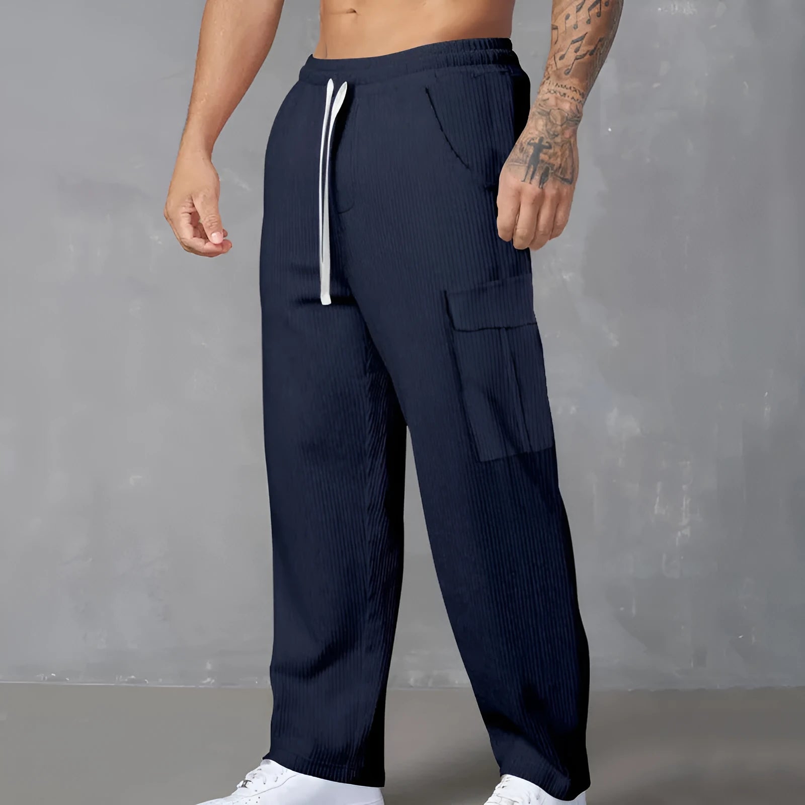 Men's straight-leg corduroy cargo trousers in navy blue with a drawstring waist.