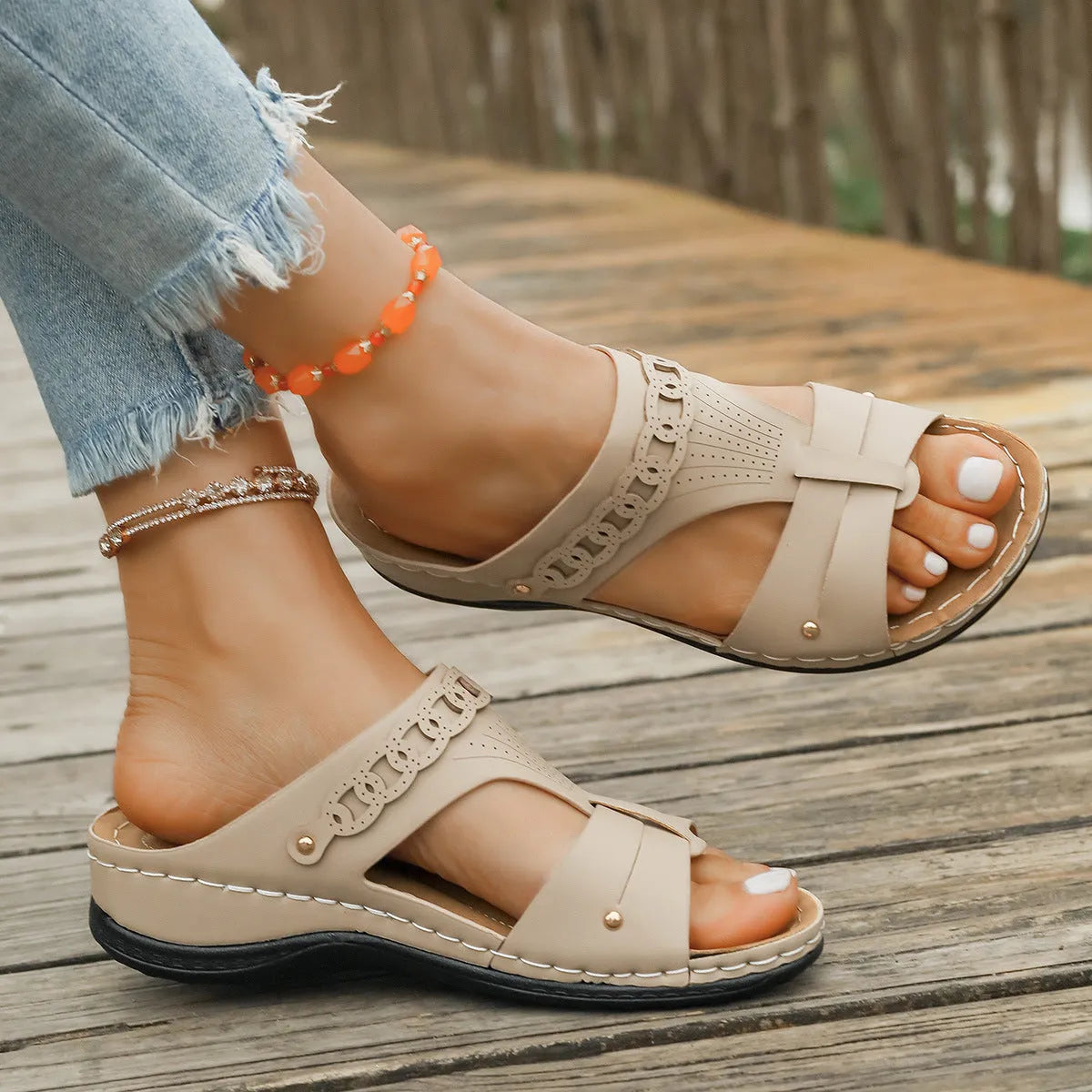 Roman style slippers showing heel slope design and fish mouth toe in beige colour on rubber sole