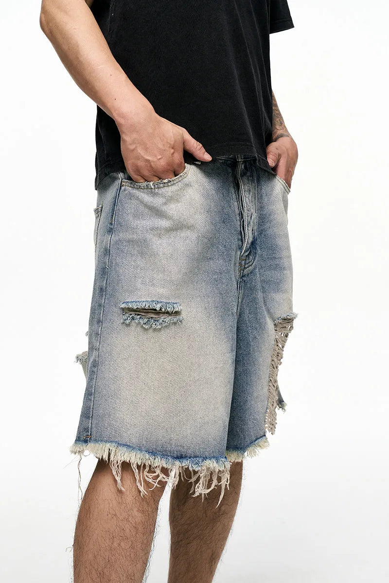 Men's light blue baggy denim shorts with wide leg design and mid waist