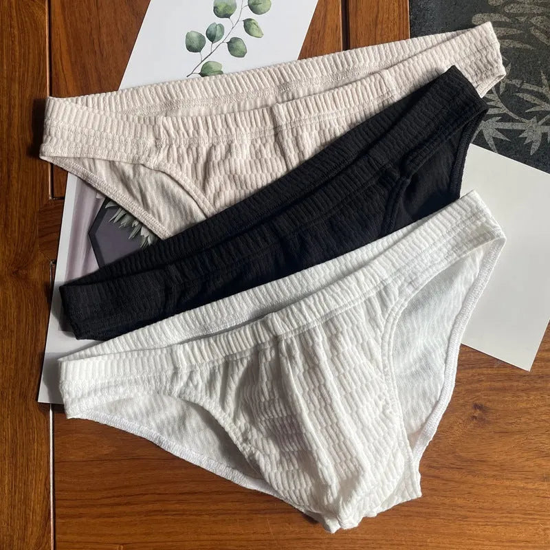 Men's cotton briefs in solid colours showing mid waist and triangle design