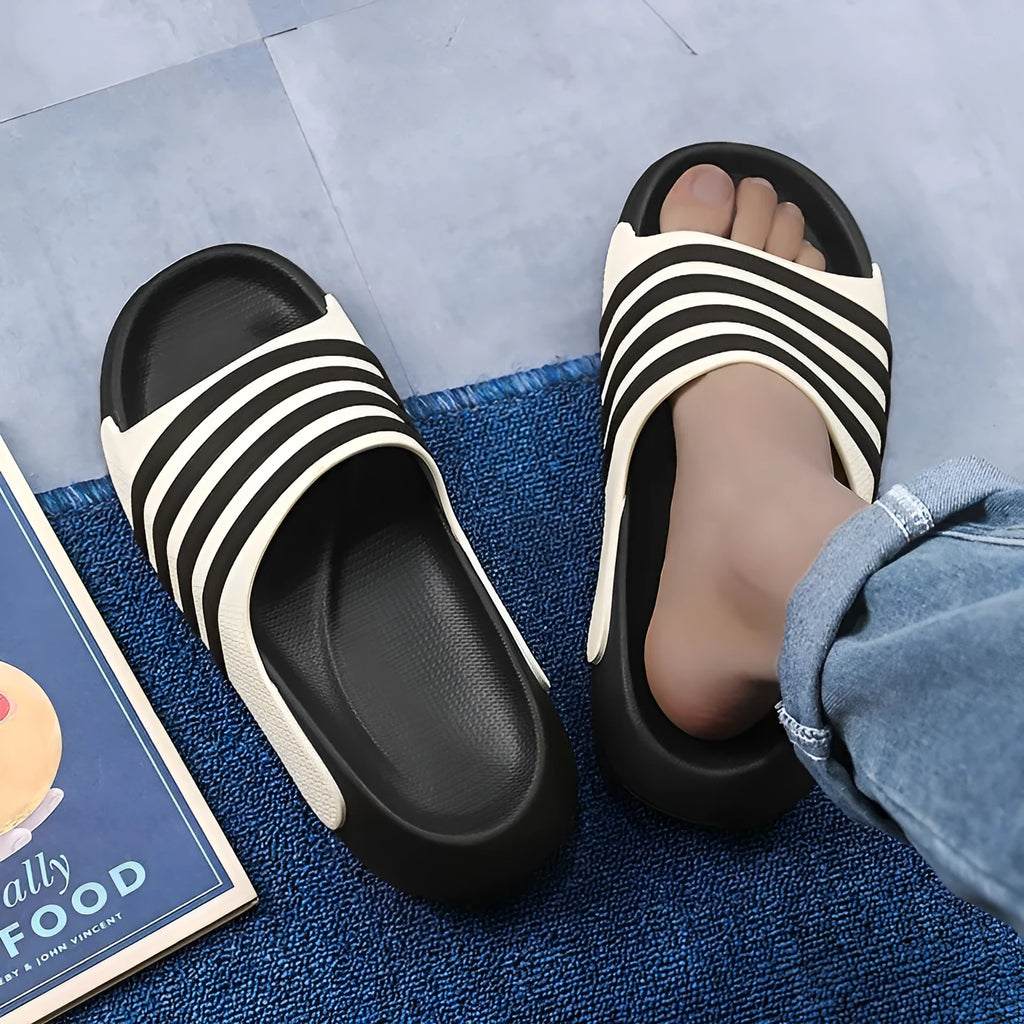 A pair of casual sport-style slippers with an EVA sole and PVC upper, shown in one of the available colour options.