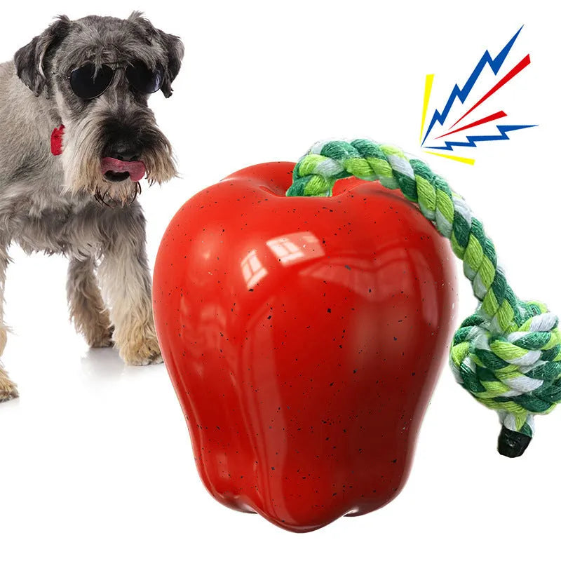 Green apple-shaped plastic dog chew toy with treat-dispensing opening