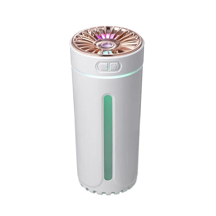 Black portable ultrasonic humidifier with colourful LED lights, shown next to a USB cable on a desktop.