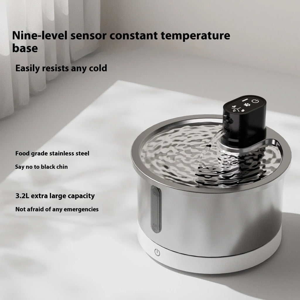 White stainless steel heated water fountain for cats and dogs on a counter