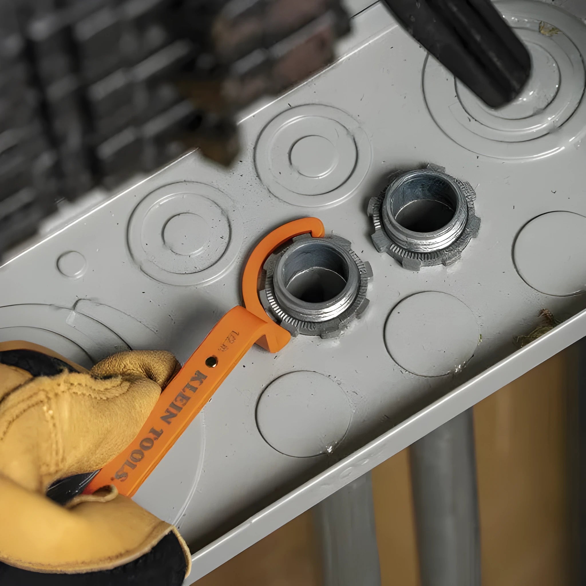 Three-piece magnetic suction wrench kit showing orange, grey, and black tools with different dimensions