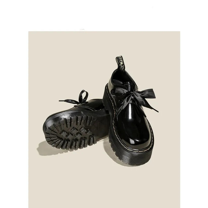 Women's thick soled leather shoes with ribbon and cross strap details in white or black