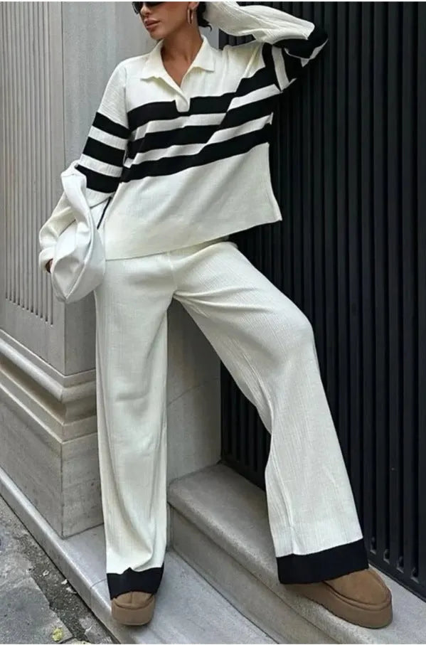 Women's black and white striped knitted two-piece set with polo collar and matching trousers