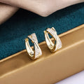 Geometric copper hoop earrings with zircon detailing in 14K yellow colour