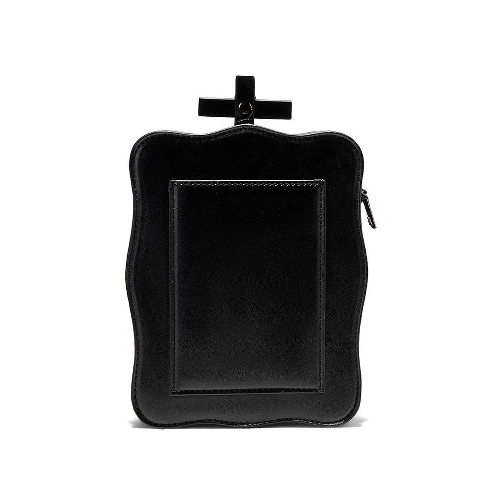Black Gothic skull crossbody bag with square shape, chain detail, and zipper opening