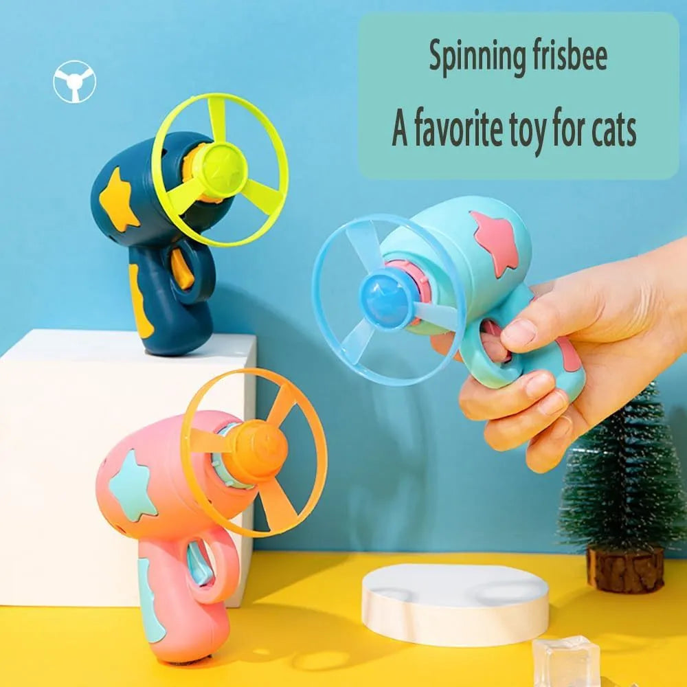 Blue plastic cat toy gun with spinning frisbee for indoor feline entertainment