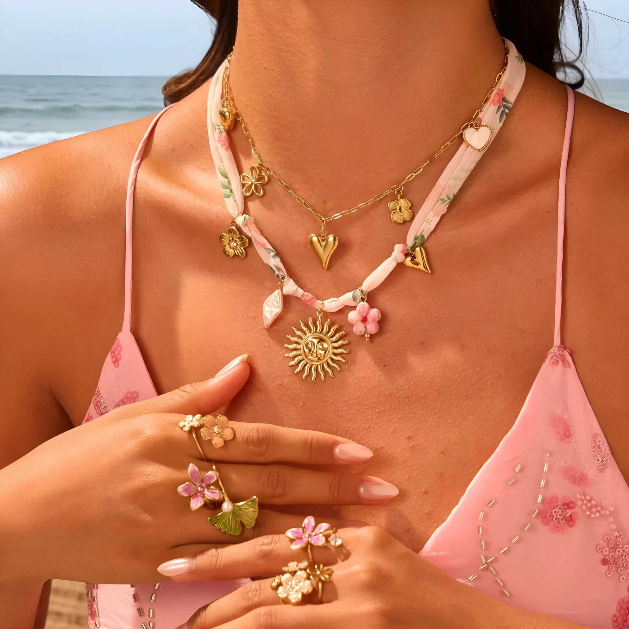 Gold-plated stainless steel necklace showing geometric sun pendant on an adjustable chain.