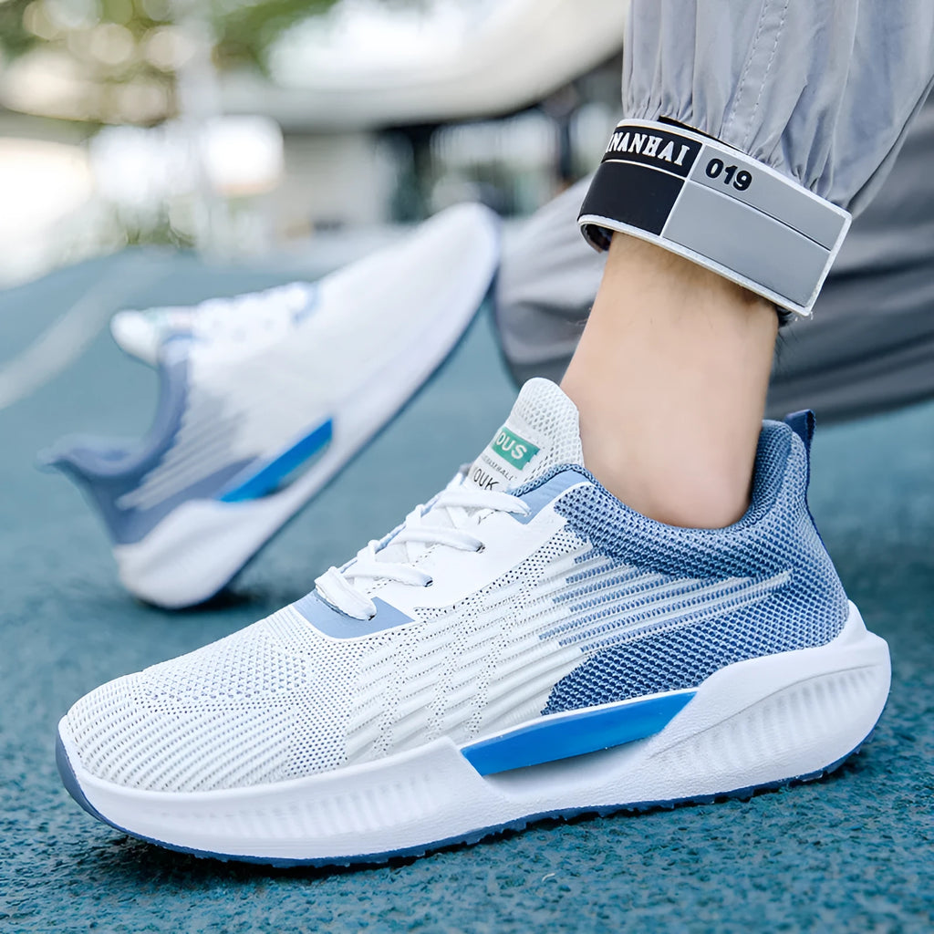 Men's blue casual sports shoes with cloth mesh upper and round toe design on a white background