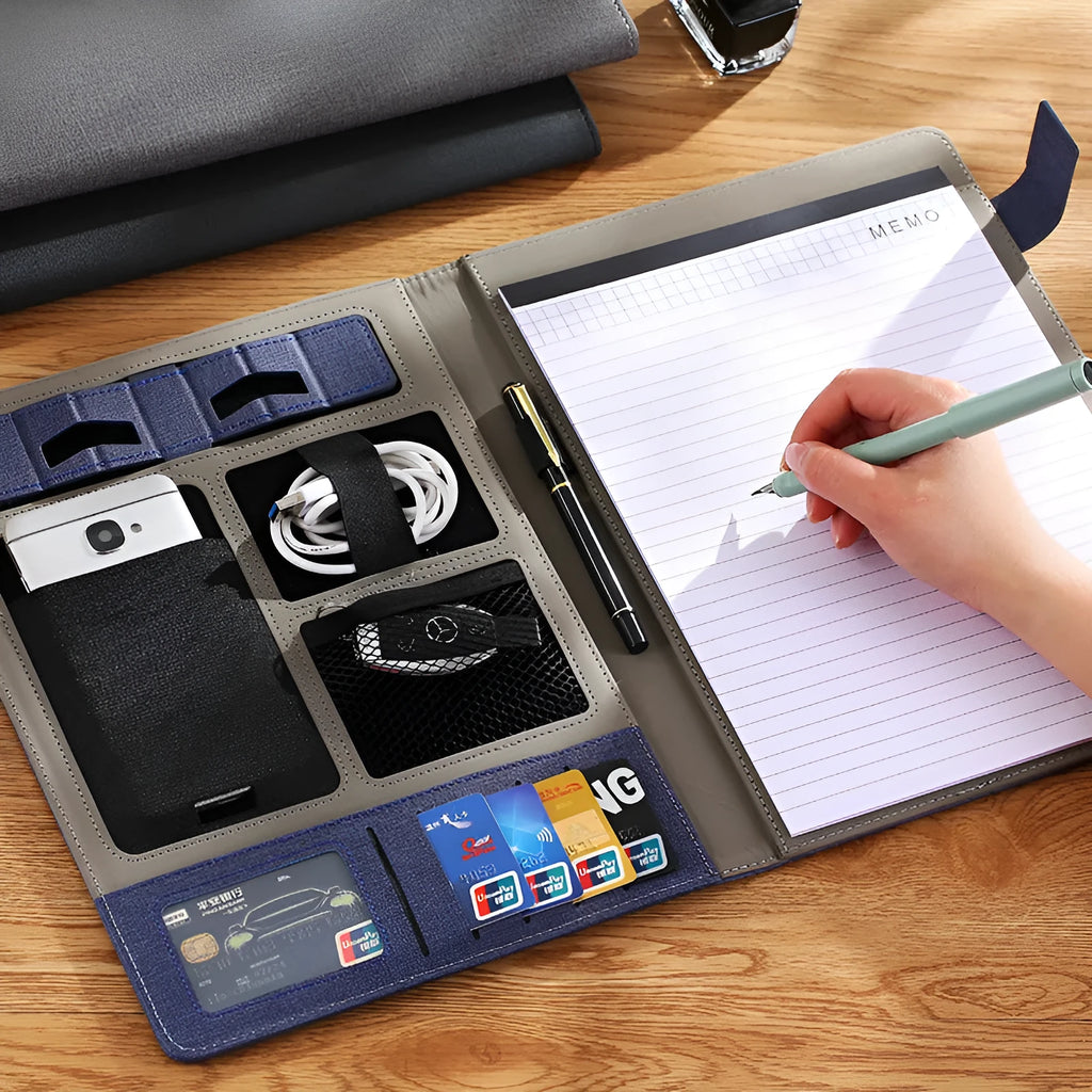 Black leather A4 business folder holding documents, with pen and notepad accessory options.