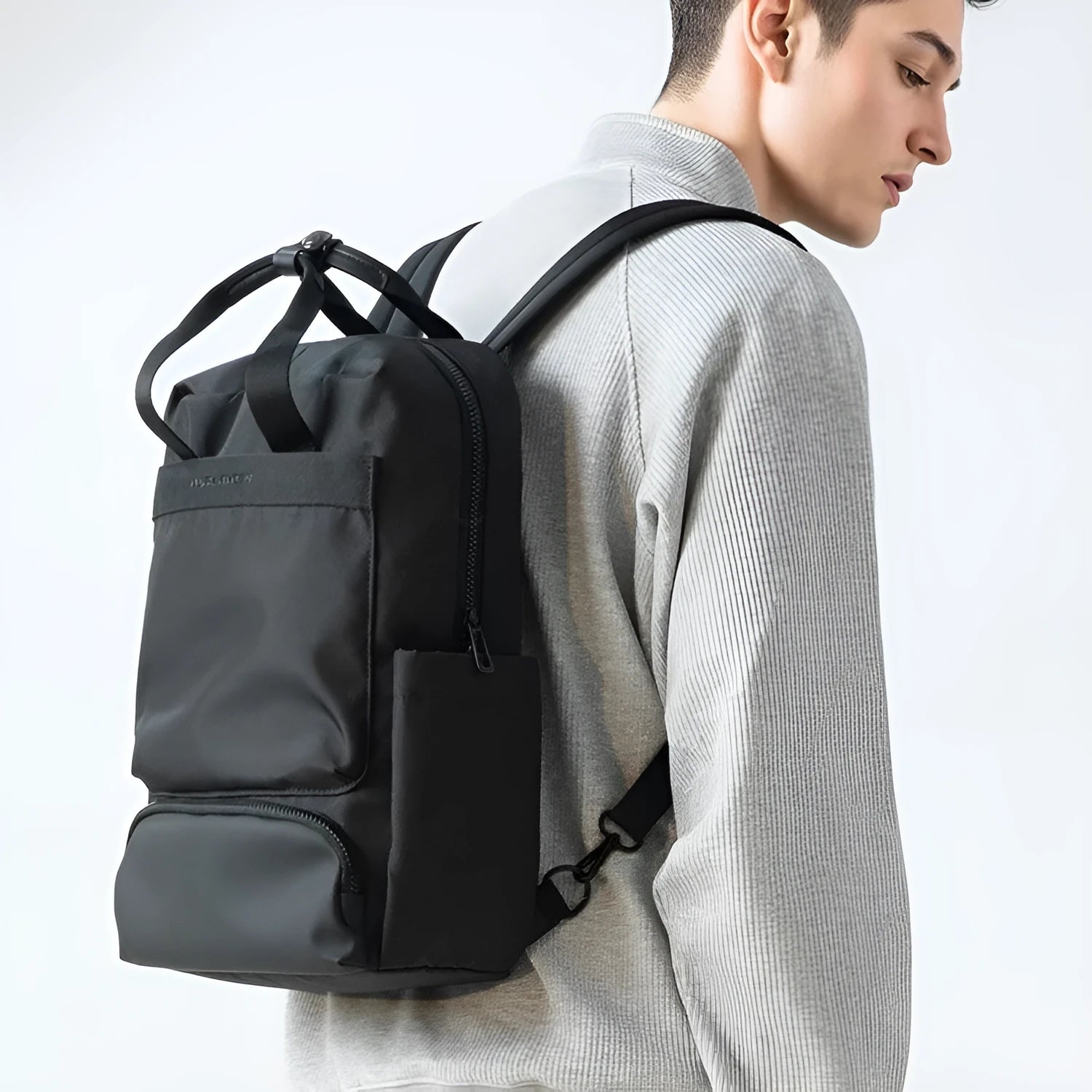 Black Oxford cloth computer backpack with 20-35L capacity showing interior polyester lining