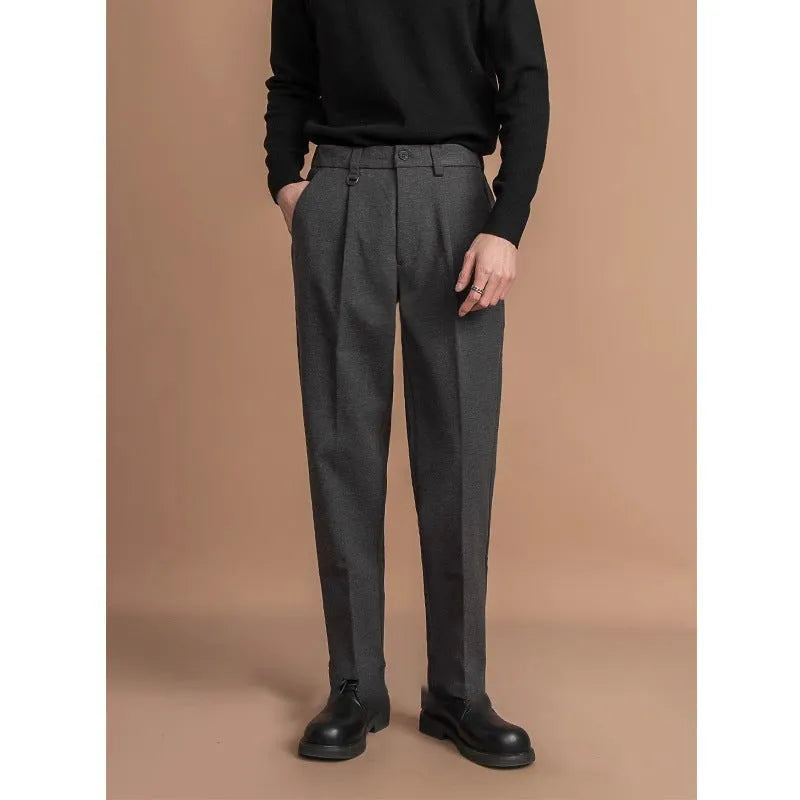 Men's straight leg polyester trousers in black on a hanger, business casual style