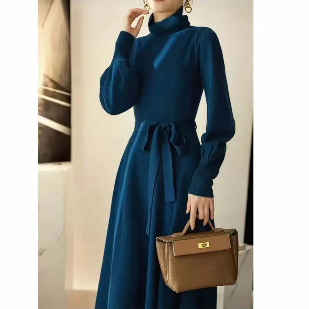 A rose red turtleneck knit dress with long sleeves, an elastic waist, and a loose mid-length skirt.