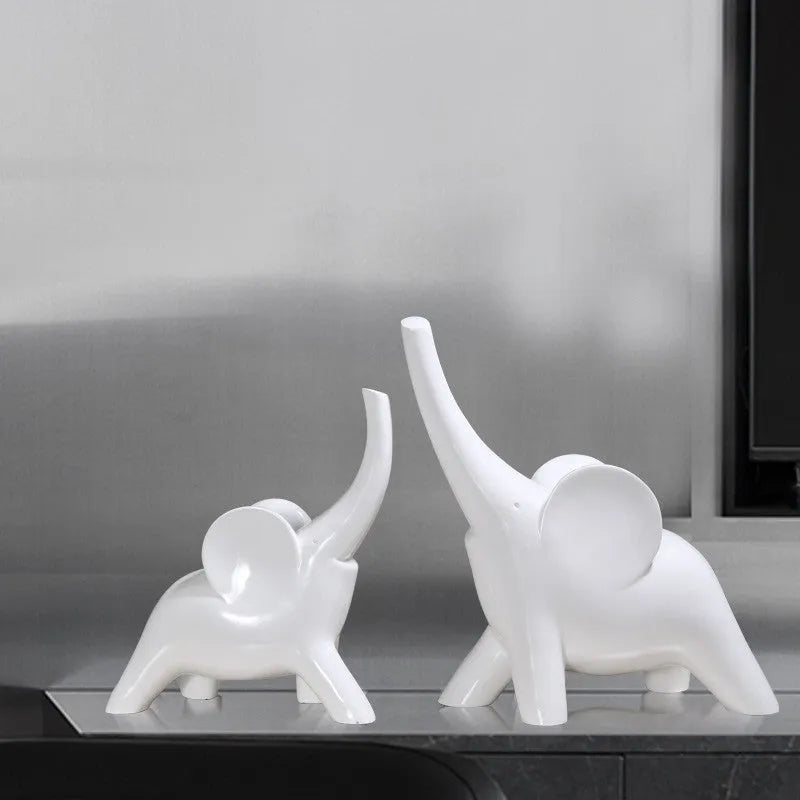 Modern resin elephant ornament in rose gold colour displayed on wooden surface