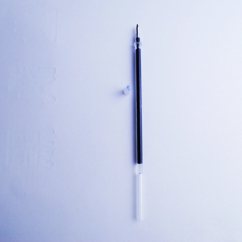 Blue automatic fading pen set with eight refills and pen holder showing 0.5mm tip