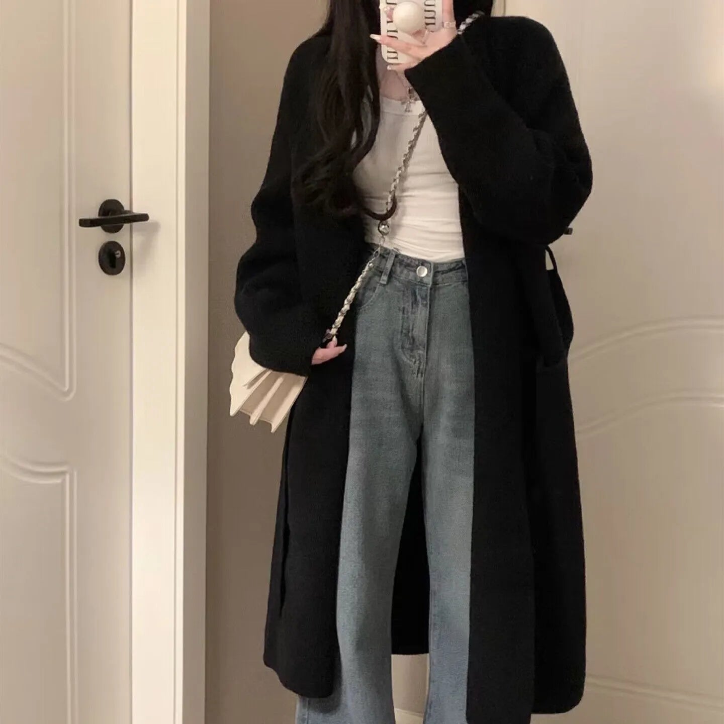 Women's loose knitted cardigan in chenille fabric showing 65cm length and solid colour options