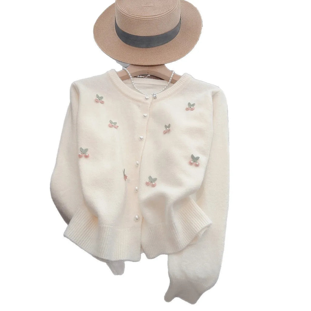 Pink cashmere cardigan coat with bead detailing, shown with a round neck and slim fit.