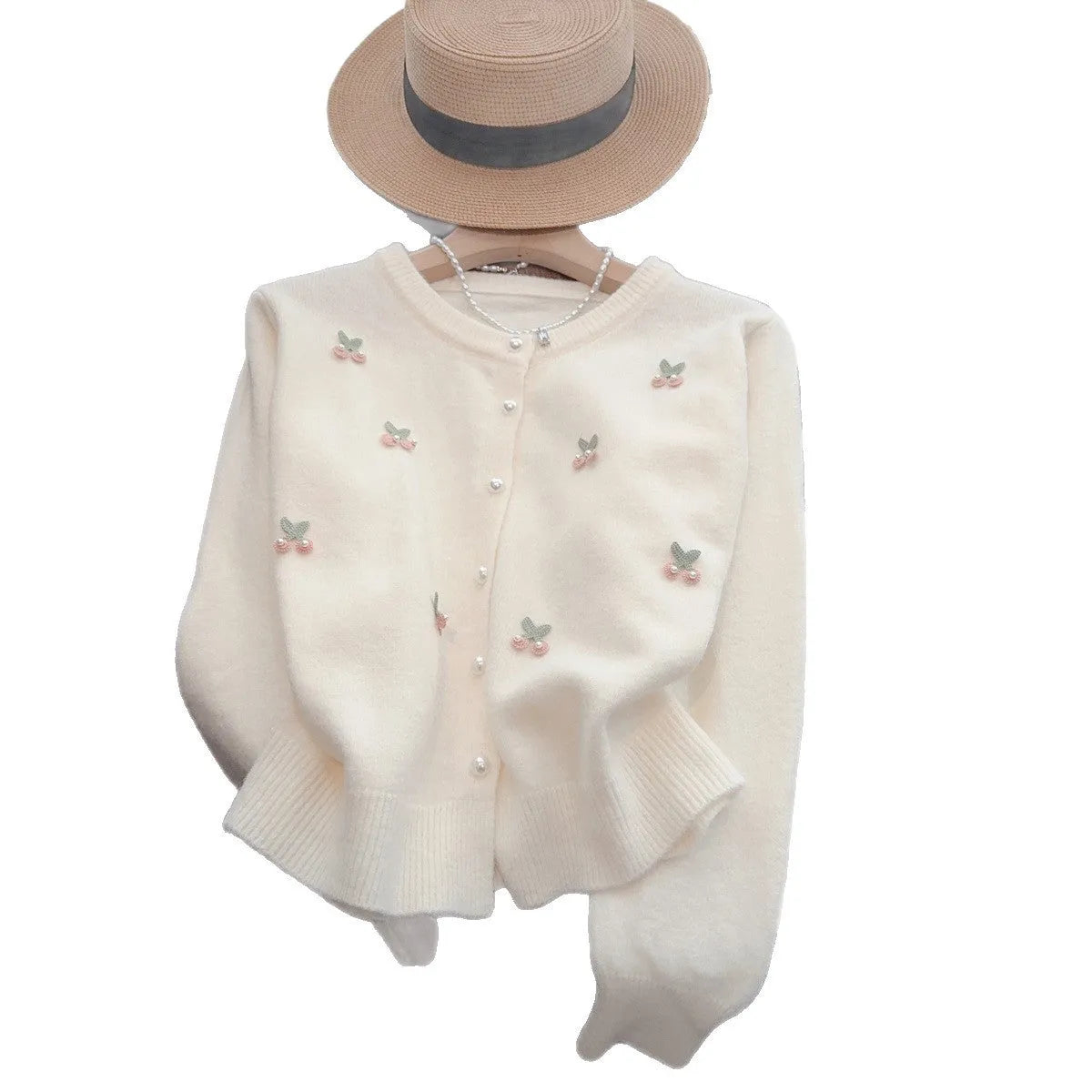 Pink cashmere cardigan coat with bead detailing, shown with a round neck and slim fit.