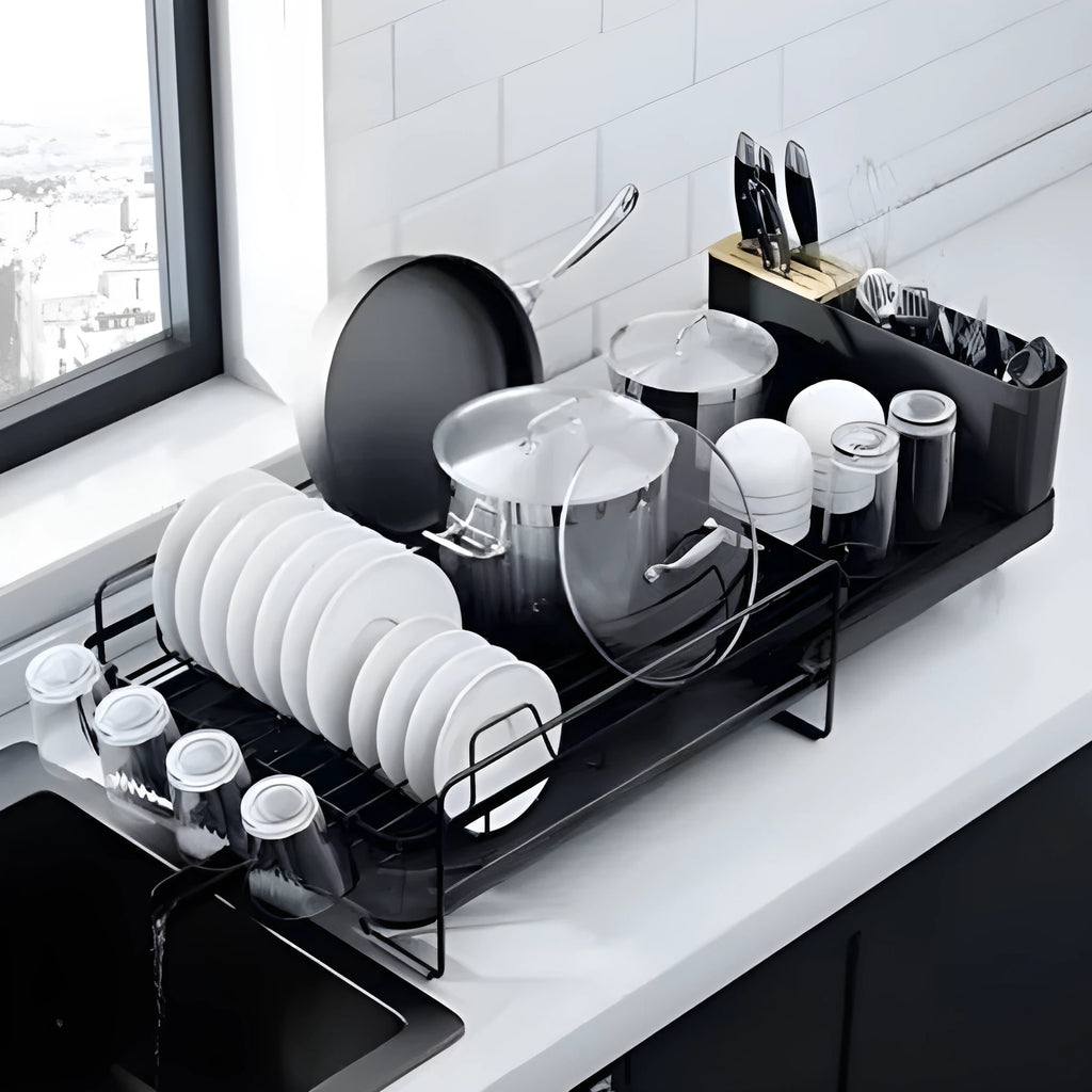 Retractable carbon steel kitchen dish drain rack for knives and forks on a countertop.