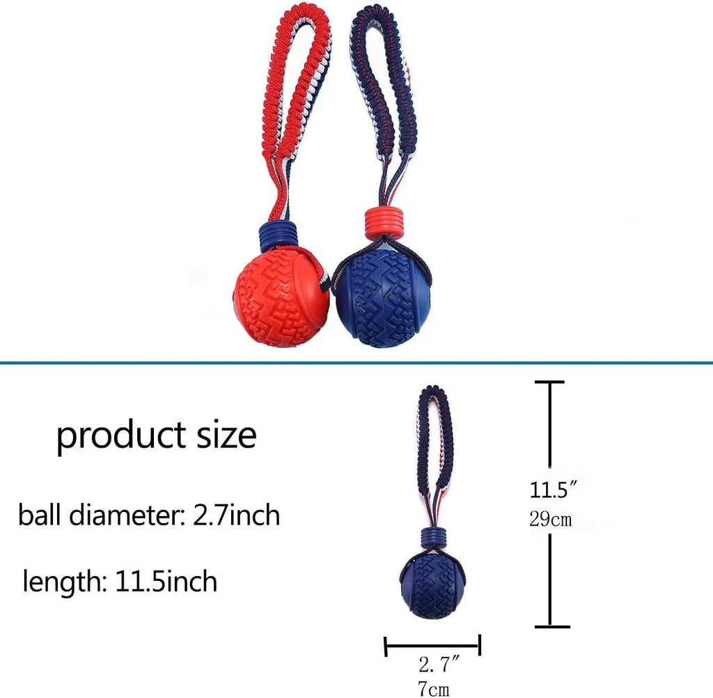 Blue or red natural rubber dog ball with rope attachment, showing textured surface and 29cm total length