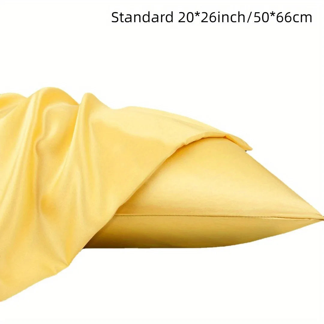 A pair of solid colour satin pillowcases in a chosen shade, showing the smooth plain weave fabric texture.