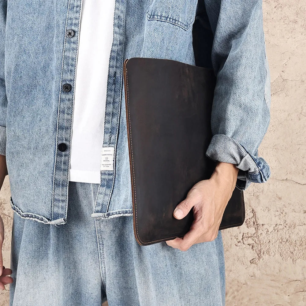 Brown Crazy Horse leather horizontal computer liner bag with a laptop inside