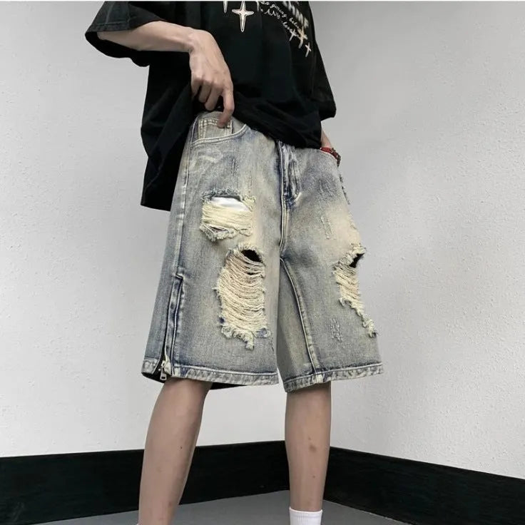 Blue retro tattered denim shorts with a wide leg loose fit on a mannequin