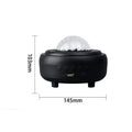 White and black rechargeable galaxy star projector night light with Bluetooth speaker on a table.