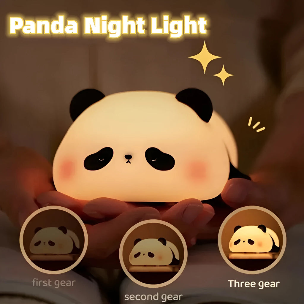 Panda shaped silicone night light with warm white glow on dark surface
