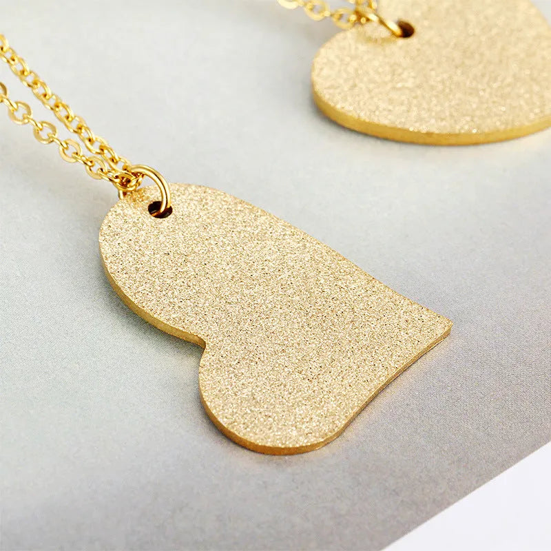 Titanium steel necklace with geometric heart-shaped pendant in colour KN25736Z