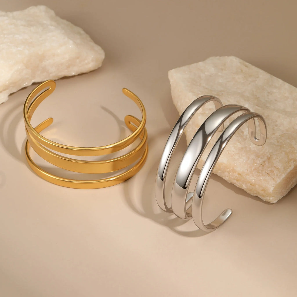 Stainless steel women's bracelet with simple opening clasp and geometric line design in gold electroplated finish
