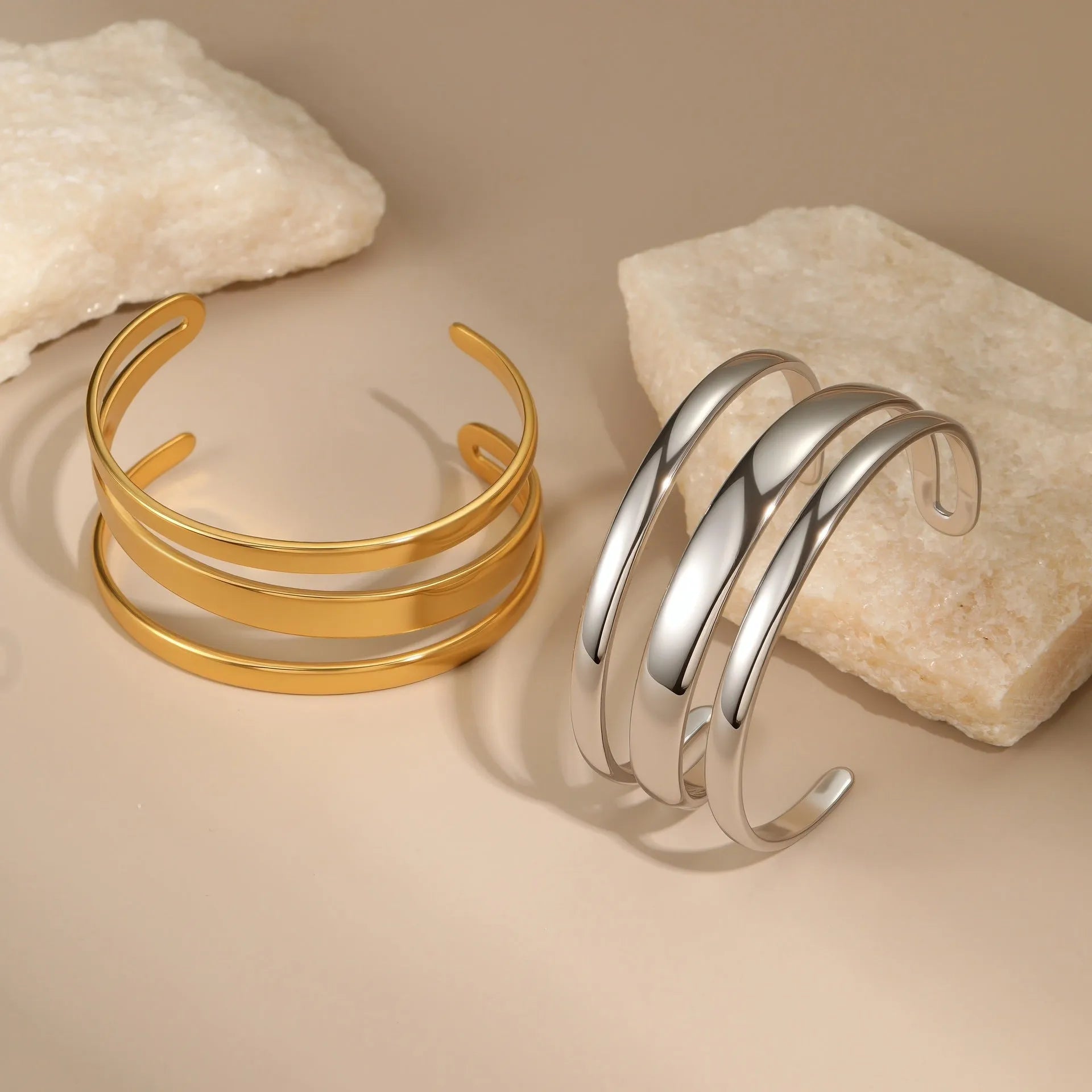 Stainless steel women's bracelet with simple opening clasp and geometric line design in gold electroplated finish