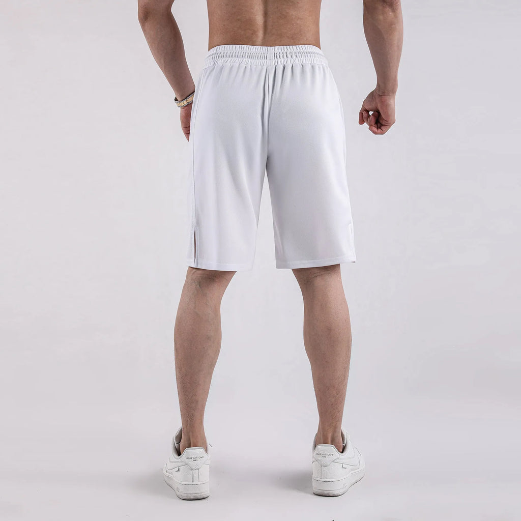 Man wearing black loose-fit quick-dry mesh shorts for summer sports.