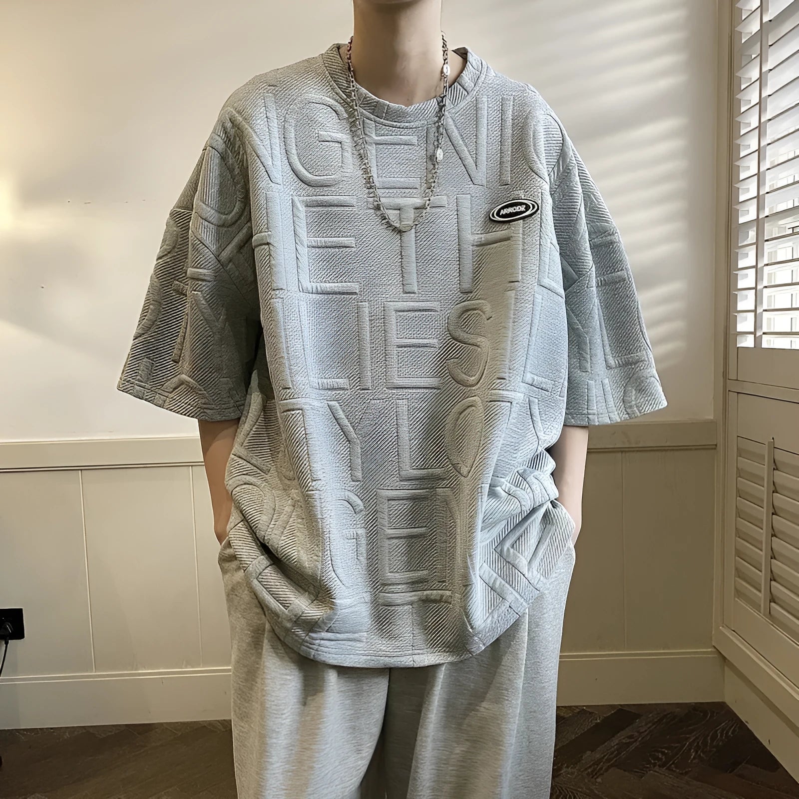 Men's grey loose retro T-shirt with a raised 3D letter print on the chest