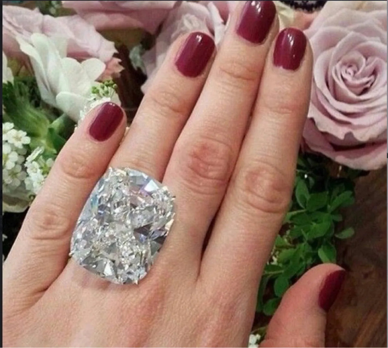 Simple inlaid white square diamond ring on a geometric alloy band with a white gold colour finish.