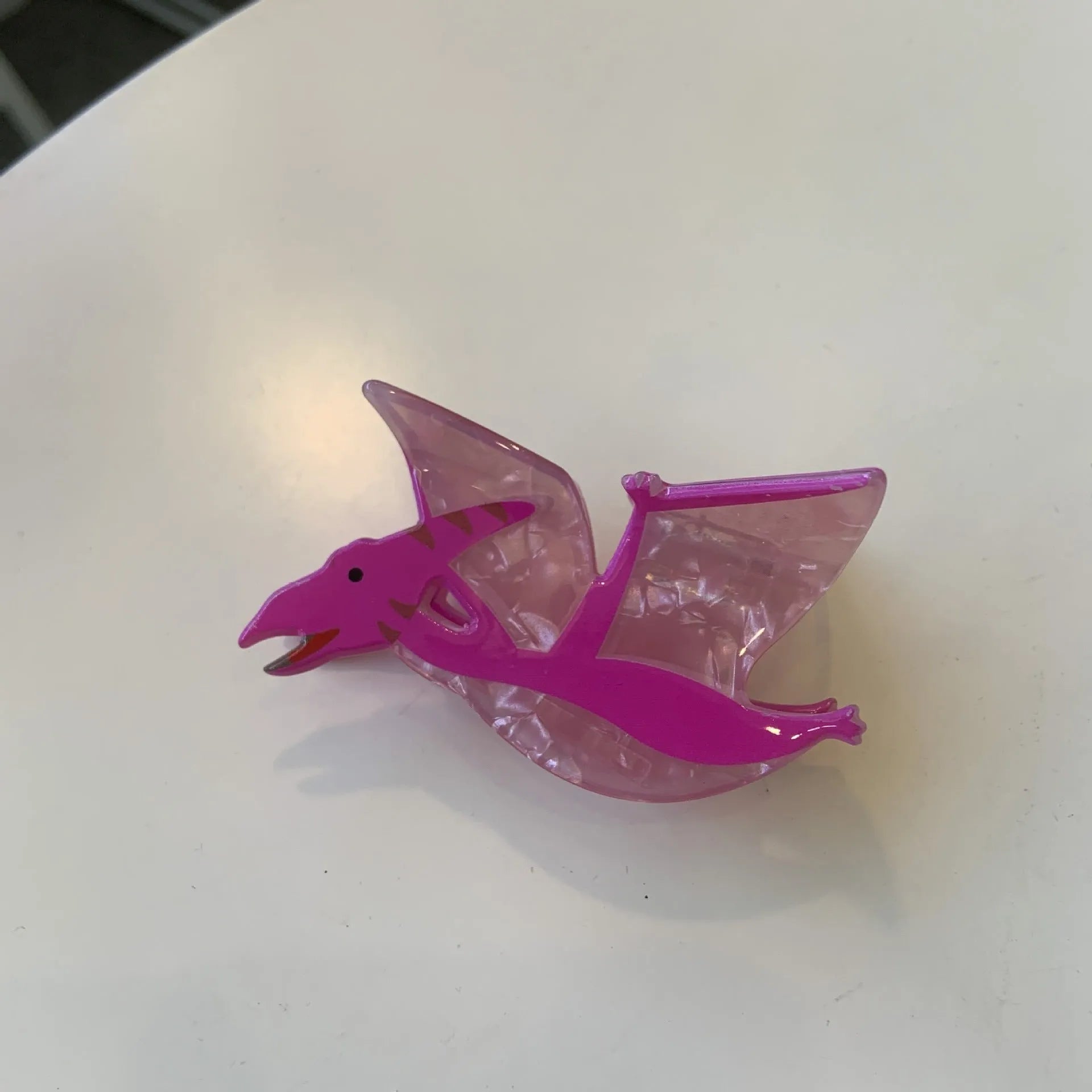 Acrylic dinosaur jaw hair clip in pink pterosaur colour with grip fastening mechanism