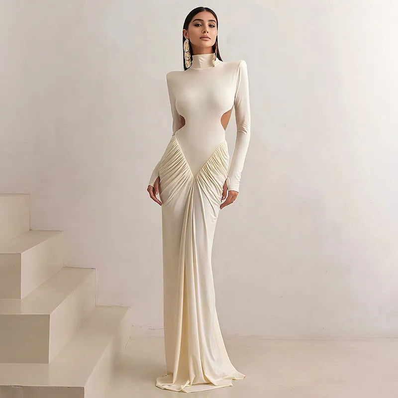 Women's slim fit backless dress with long sleeves, high collar, and pleats in light apricot colour