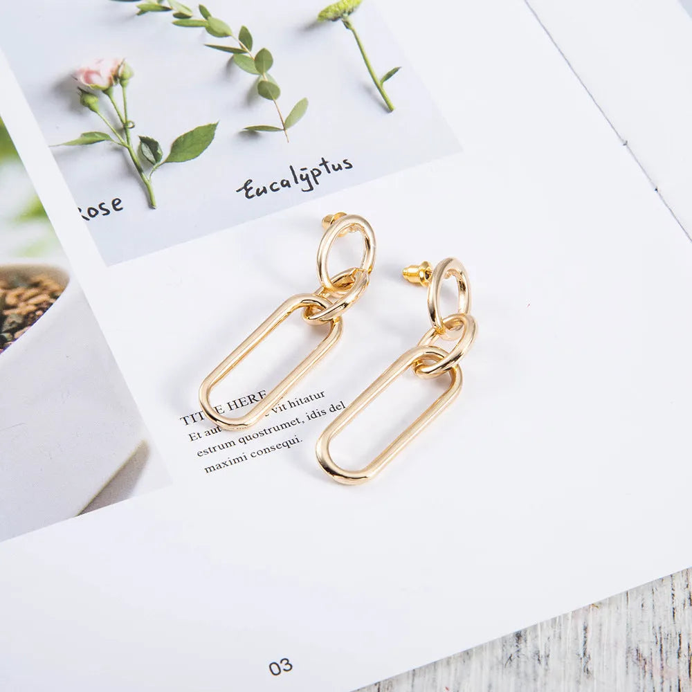 Sterling silver geometric hoop earrings for women with ring and line design elements