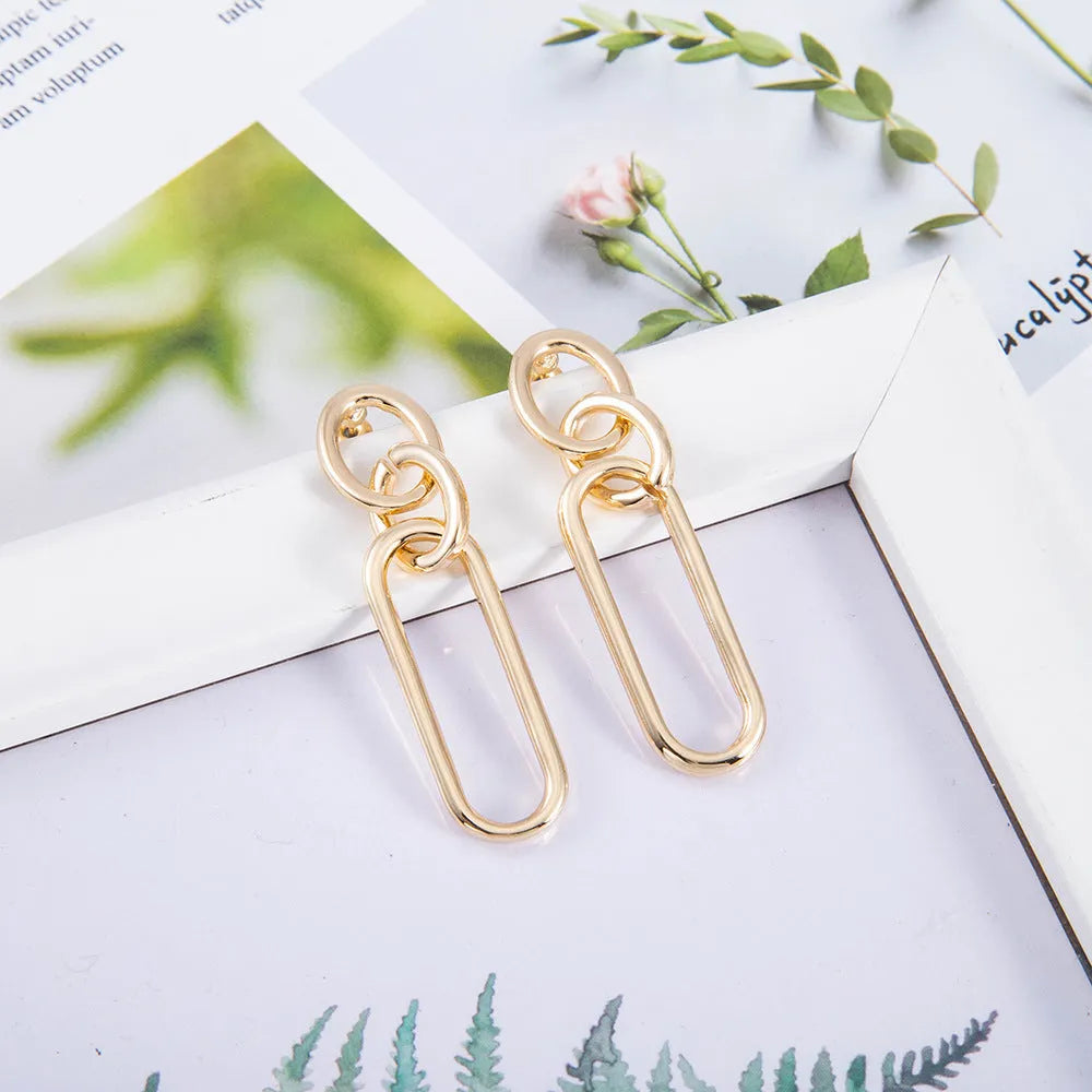 Sterling silver geometric hoop earrings for women with ring and line design elements