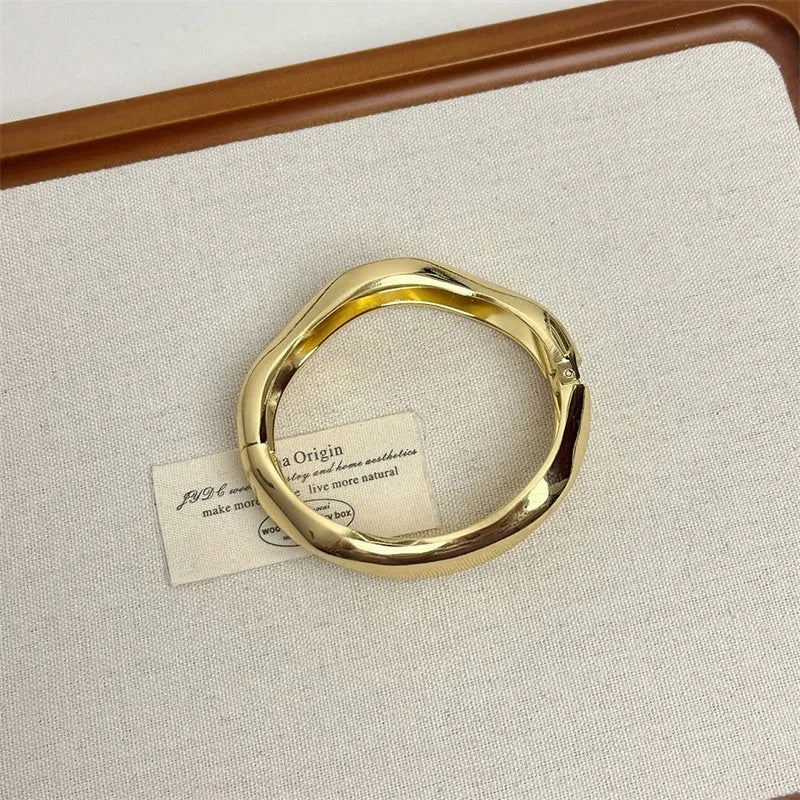 Irregular wide-brimmed zinc alloy bracelet with spring open design and electroplated finish in simple style